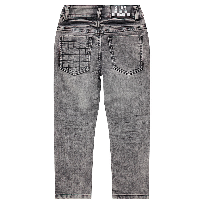 Jeans effet used avec jeux de surpiqûres et découpes 