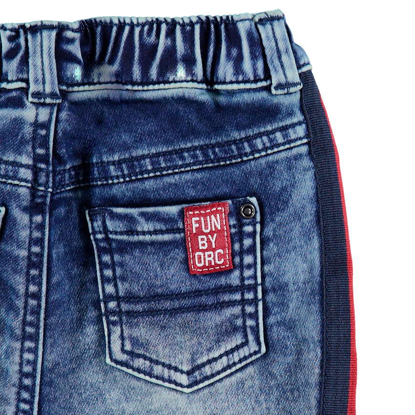 Jeans effet used élastiqué avec bandes contrastées sur les cotés 