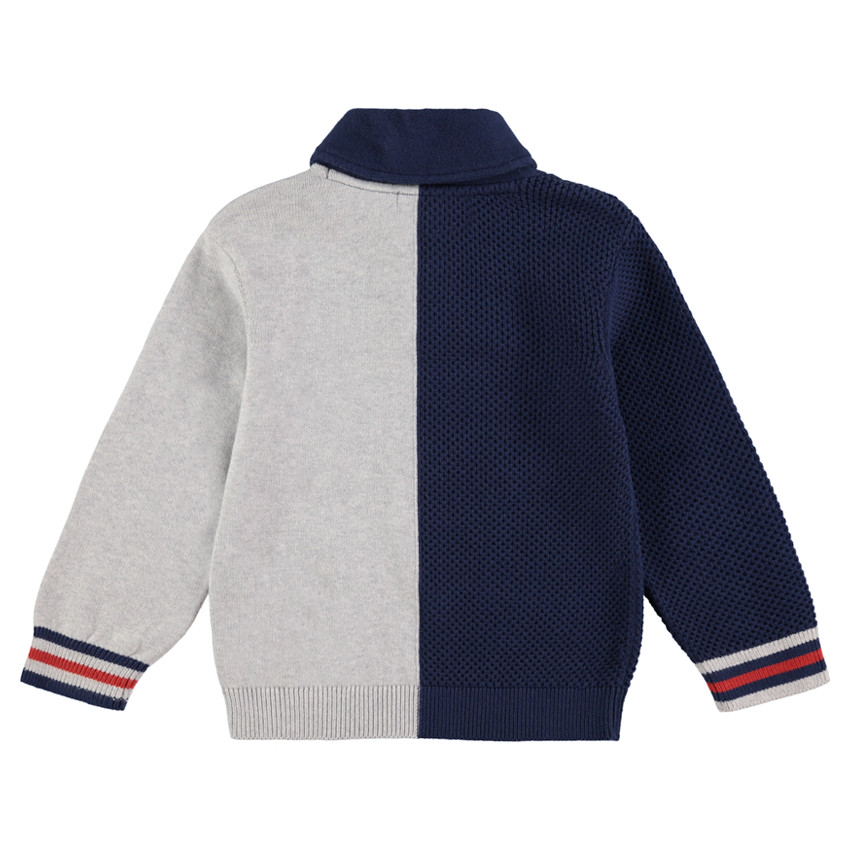 Pull en tricot bicolore avec col zippé et inscription en bouclette 