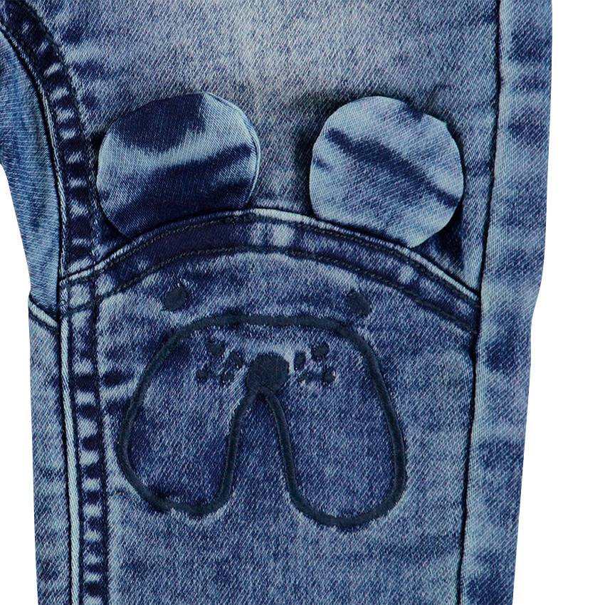 Jeans effet used et crinkle avec oreilles en relief  