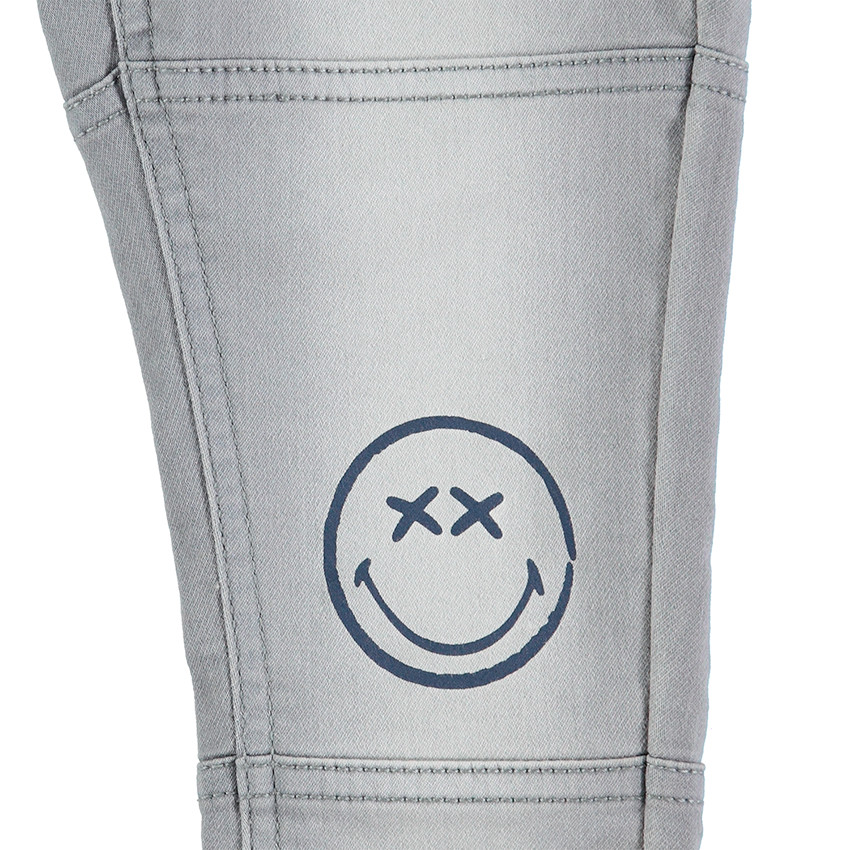 Jeans en molleton effet used avec prints Smiley 