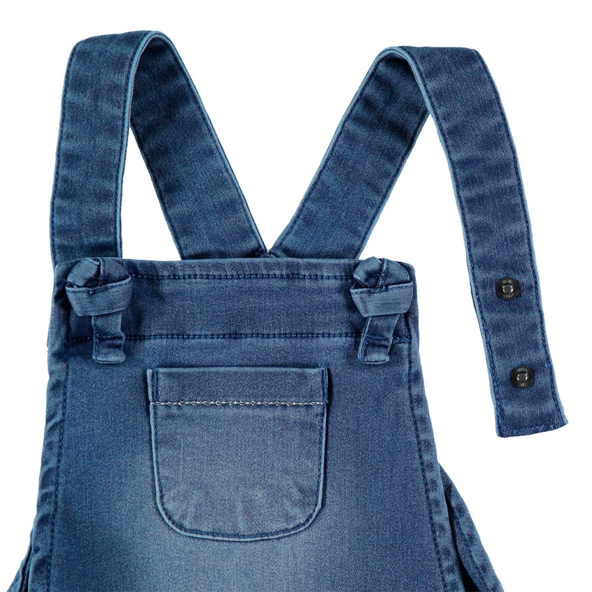 Salopette en jean effet used à fleurs brodées 