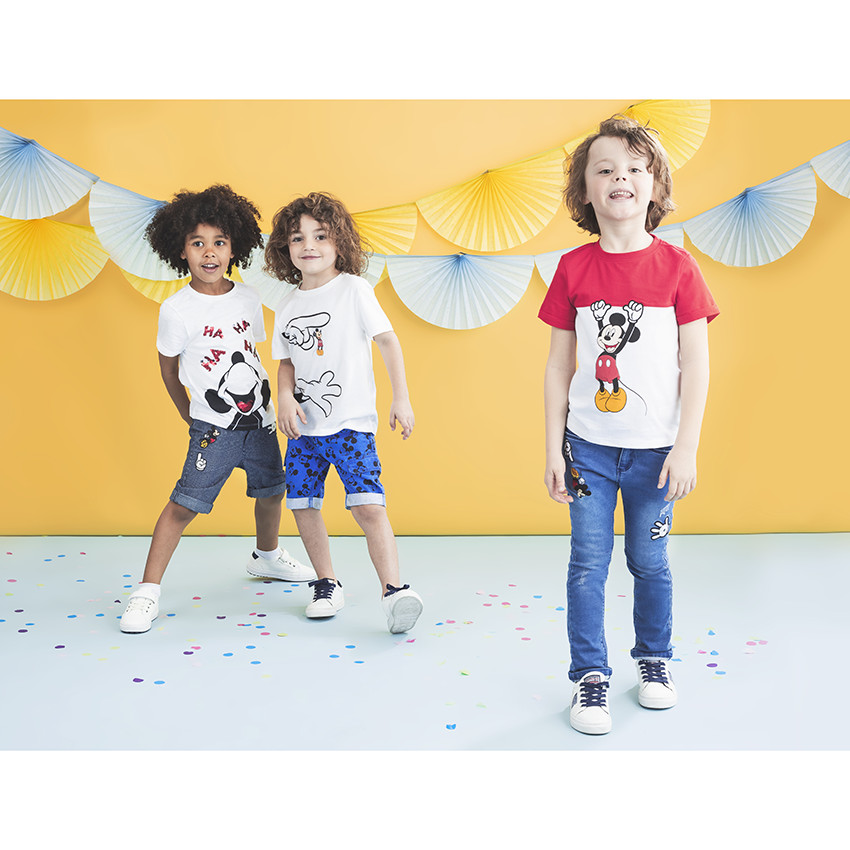 Jean slim effet used à badges Mickey Disney 