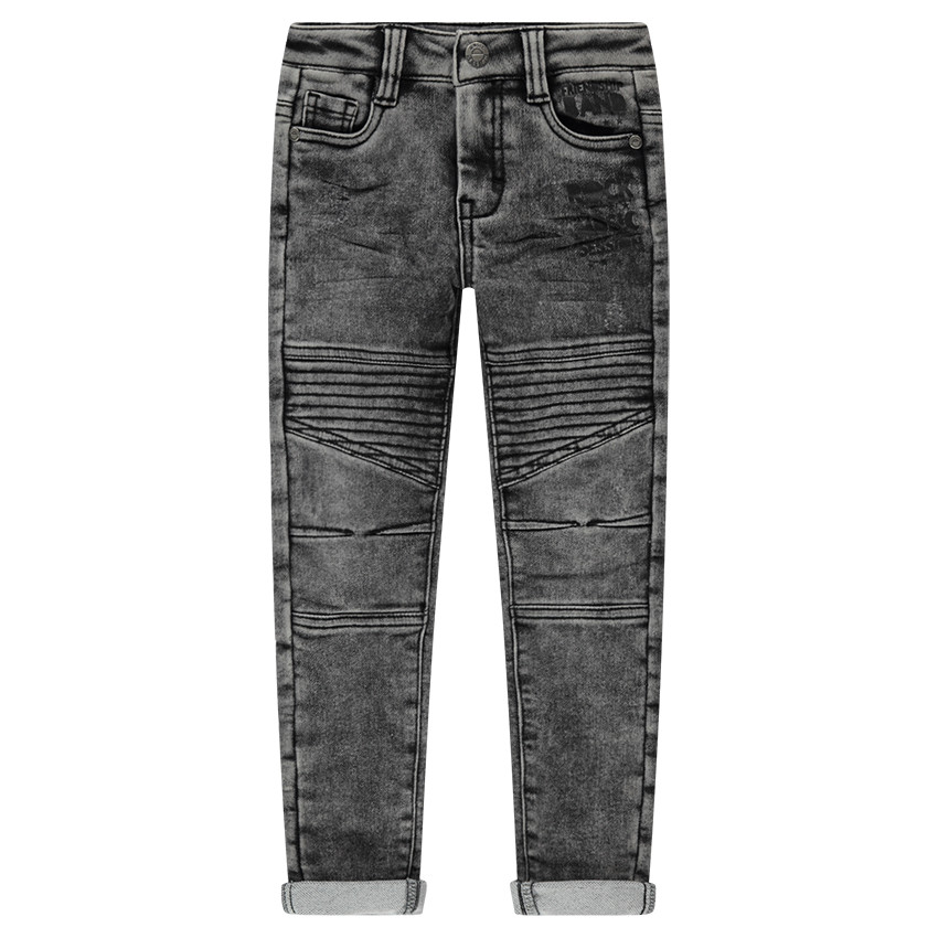 Jeans en denim like effet used avec badge guitare 