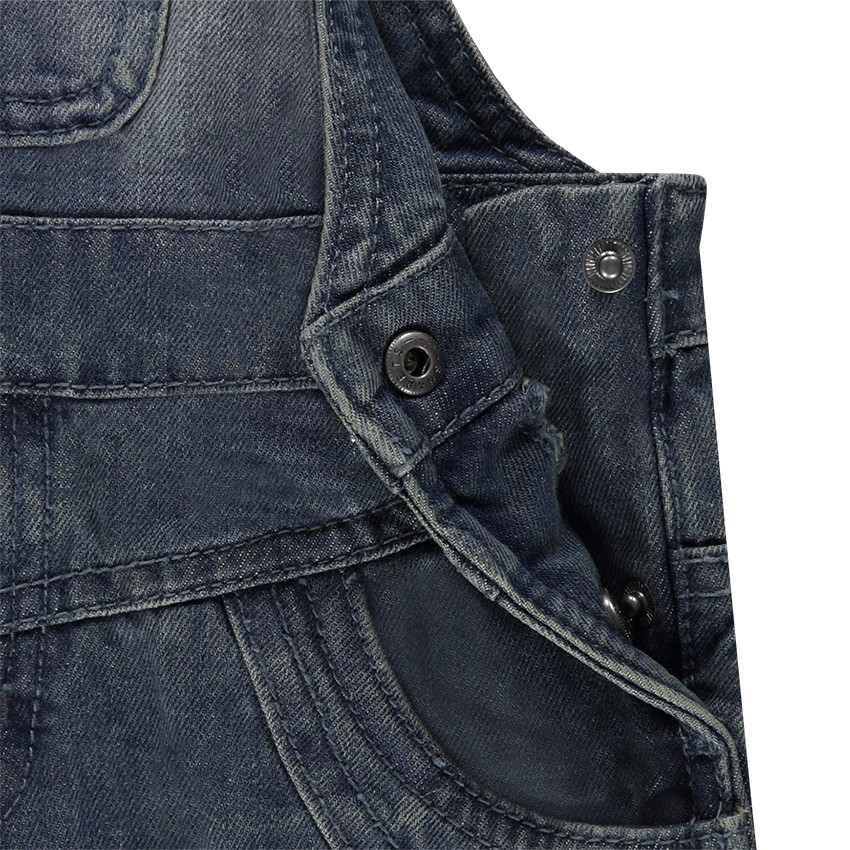 Salopette en jeans effet used et crinkle 