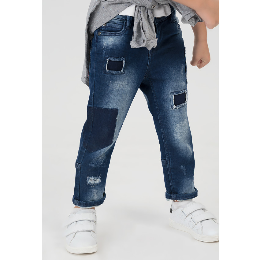 Jeans en denim like effet used avec déchirures et poches 