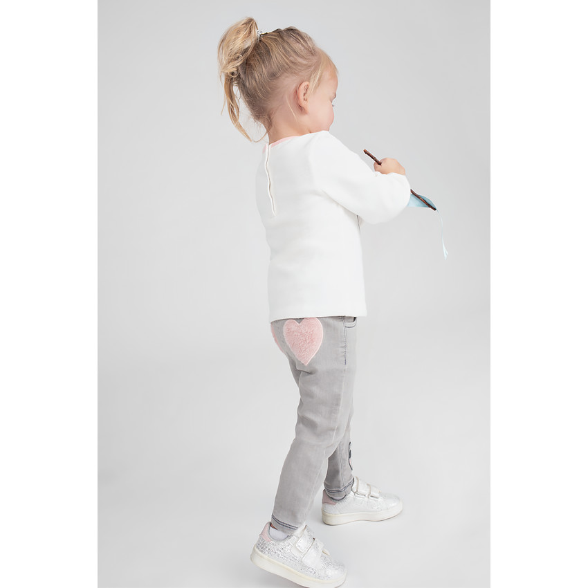 Jeans effet used avec coeurs en sherpa 