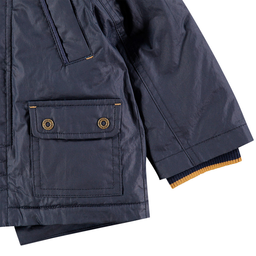 Parka enduite avec doublure en sherpa et poches 