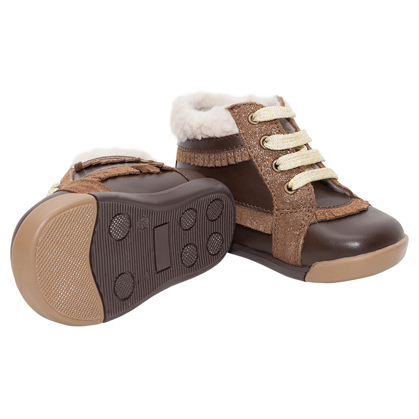 Bottillons en cuir fourrés avec franges pailletées  