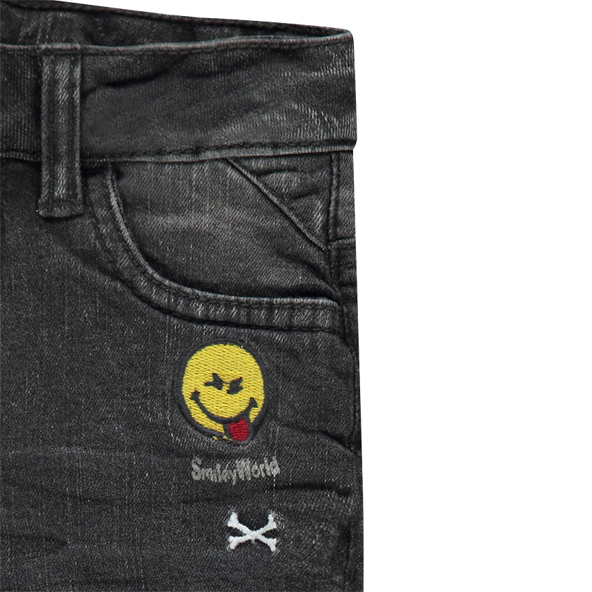 Jeans effet used doublé jersey avec badges brodés 