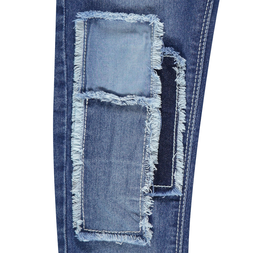 Jeans slim à patchs et franges effet used 