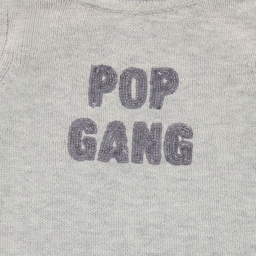 Pull en tricot uni avec message en sequins 