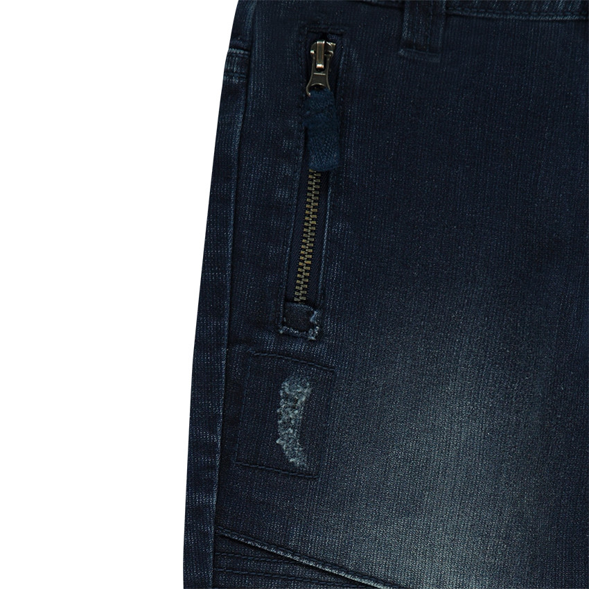 Jeans effet used fitté avec poches zippées 