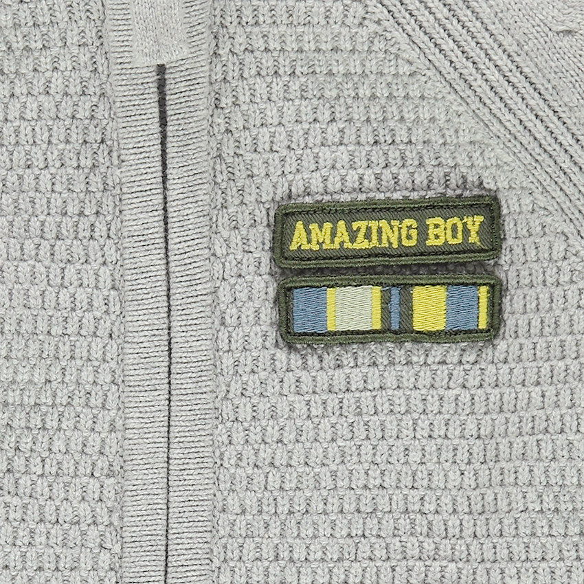 Gilet en tricot zippé avec badge patché sur la poitrine 