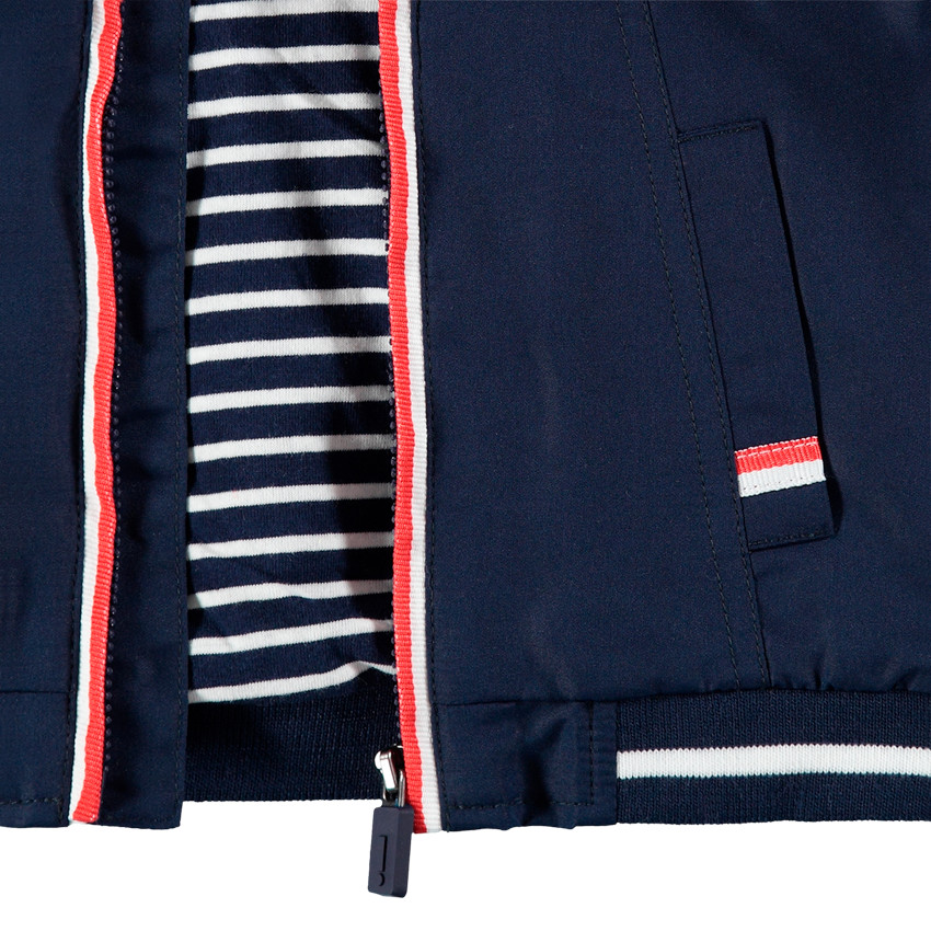 Coupe-vent uni avec doublure en jersey rayé et poches 